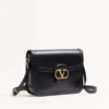 Sac à bandoulière Valentino Garavani 9To5 en cuir de veau lisse Sac à bandoulière Valentino Garavani 9To5 en cuir de veau lisse