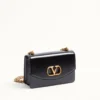 Sac à bandoulière Valentino Garavani Vain en cuir de veau brillant Sac à bandoulière Valentino Garavani Vain en cuir de veau brillant