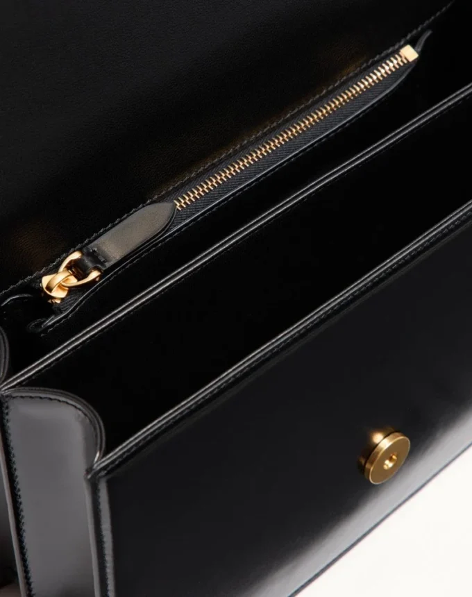 Sac à bandoulière Valentino Garavani Vain en cuir de veau brillant Sac à bandoulière Valentino Garavani Vain en cuir de veau brillant