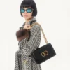 Sac à bandoulière Valentino Garavani Vain en cuir de veau brillant Sac à bandoulière Valentino Garavani Vain en cuir de veau brillant