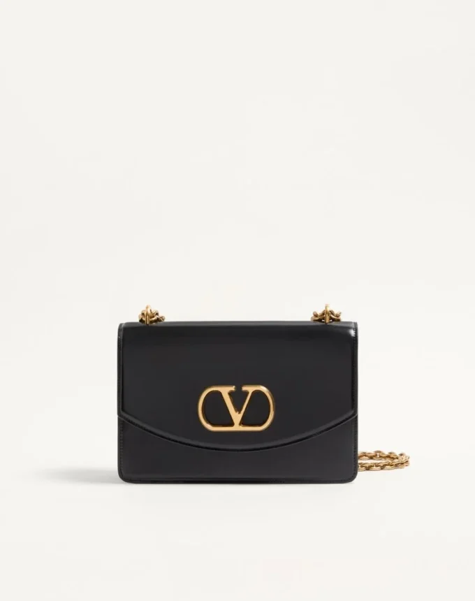 Sac à bandoulière Valentino Garavani Vain en cuir de veau brillant Sac à bandoulière Valentino Garavani Vain en cuir de veau brillant