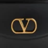Sac à bandoulière Valentino Garavani Vain en cuir de veau brillant Sac à bandoulière Valentino Garavani Vain en cuir de veau brillant