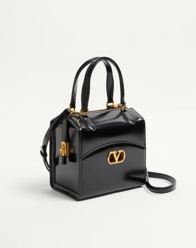 Sac bowling Valentino Garavani Vain-Case en cuir de veau brillant Sac bowling Valentino Garavani Vain-Case en cuir de veau brillant