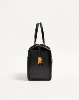 Sac bowling Valentino Garavani Vain-Case en cuir de veau brillant