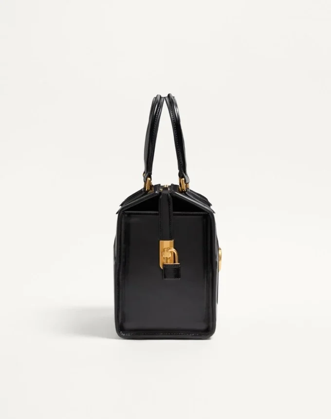 Sac bowling Valentino Garavani Vain-Case en cuir de veau brillant Sac bowling Valentino Garavani Vain-Case en cuir de veau brillant