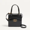 Sac bowling Valentino Garavani Vain-Case en cuir de veau brillant Sac bowling Valentino Garavani Vain-Case en cuir de veau brillant