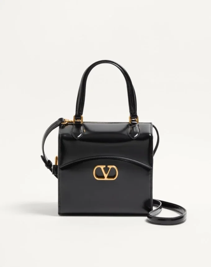 Sac bowling Valentino Garavani Vain-Case en cuir de veau brillant Sac bowling Valentino Garavani Vain-Case en cuir de veau brillant