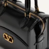 Sac bowling Valentino Garavani Vain-Case en cuir de veau brillant Sac bowling Valentino Garavani Vain-Case en cuir de veau brillant