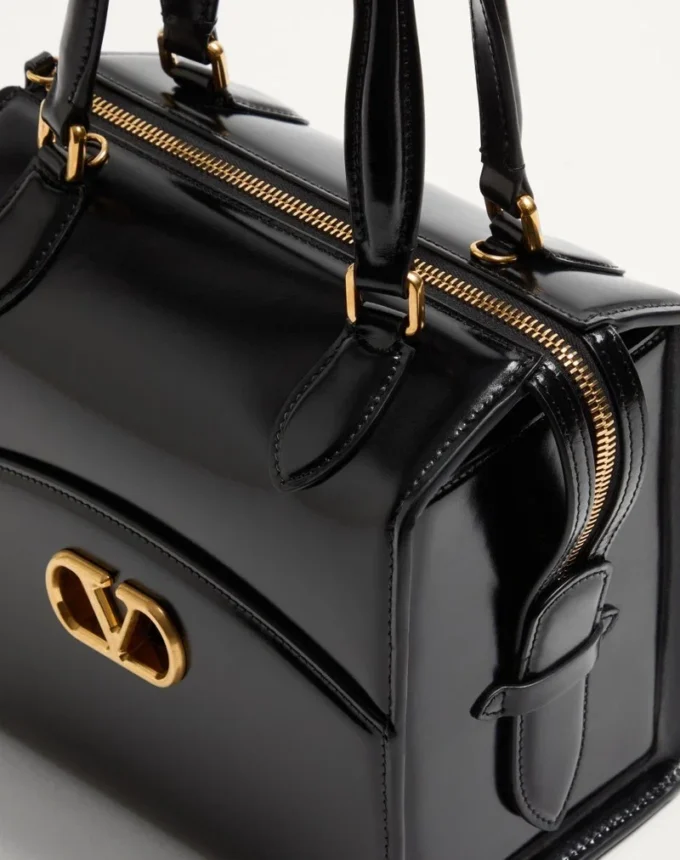 Sac bowling Valentino Garavani Vain-Case en cuir de veau brillant Sac bowling Valentino Garavani Vain-Case en cuir de veau brillant