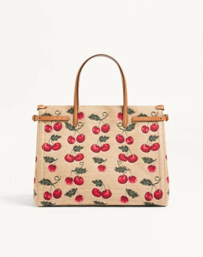 Sac cabas moyen Valentino Garavani Antibes en raphia jacquard avec motif Cherryfic Sac cabas moyen Valentino Garavani Antibes en raphia jacquard avec motif Cherryfic