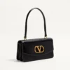 Sac Valentino Garavani Vain avec poignée en cuir de veau brillant Sac Valentino Garavani Vain avec poignée en cuir de veau brillant