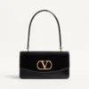 Sac Valentino Garavani Vain avec poignée en cuir de veau brillant Sac Valentino Garavani Vain avec poignée en cuir de veau brillant