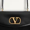 Sac Valentino Garavani Vain avec poignée en cuir de veau brillant Sac Valentino Garavani Vain avec poignée en cuir de veau brillant