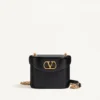 Valentino Garavani Vain Sac à main en cuir de veau brillant Valentino Garavani Vain Sac à main en cuir de veau brillant