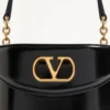 Valentino Garavani Vain Sac à main en cuir de veau brillant Valentino Garavani Vain Sac à main en cuir de veau brillant