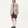 Veste en coton à simple boutonnage avec motif à carreaux et bords imprimés Veste en coton à simple boutonnage avec motif à carreaux et bords imprimés