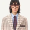 Veste en coton à simple boutonnage avec motif à carreaux et bords imprimés Veste en coton à simple boutonnage avec motif à carreaux et bords imprimés