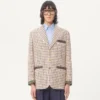 Veste en coton à simple boutonnage avec motif à carreaux et bords imprimés Veste en coton à simple boutonnage avec motif à carreaux et bords imprimés