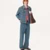 Veste en denim avec broderies de perles et bords imprimés Veste en denim avec broderies de perles et bords imprimés