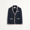 Veste en jersey de coton à simple boutonnage avec passepoil torchon Veste en jersey de coton à simple boutonnage avec passepoil torchon