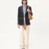 Veste en lin à simple boutonnage avec broderies et empiècements en perles Veste en lin à simple boutonnage avec broderies et empiècements en perles